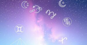 Starry night sky with zodiac symbols and soft pastel colours representing astrology and horoscopes.